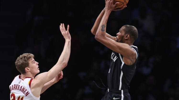 Apr 12, 2022; Brooklyn, New York, USA; Brooklyn Nets forward Kevin Durant (7) shoots the ball over Cleveland Cavaliers forward Lauri Markkanen (24) during the first half at Barclays Center. Mandatory Credit: Vincent Carchietta-USA TODAY Sports