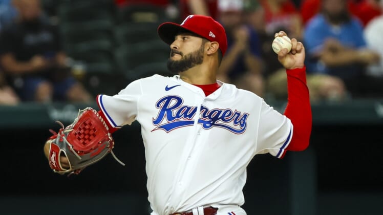 Apr 12, 2022; Arlington, Texas, USA;  Texas Rangers starting pitcher Martin Perez (54) throws during the first inning against the Colorado Rockies at Globe Life Field. Mandatory Credit: Kevin Jairaj-USA TODAY Sports