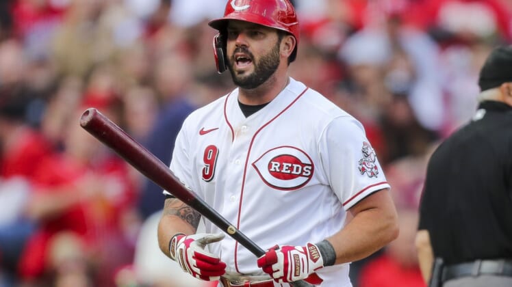 Apr 12, 2022; Cincinnati, Ohio, USA; Cincinnati Reds third baseman Mike Moustakas (9) reacts after striking out against the Cleveland Guardians in the sixth inning at Great American Ball Park. Mandatory Credit: Katie Stratman-USA TODAY Sports