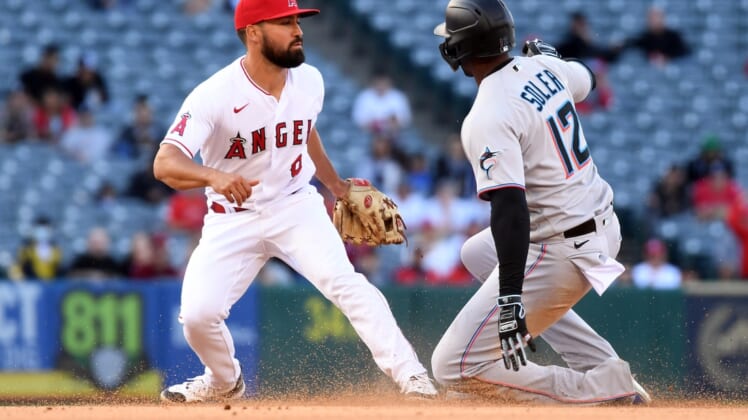 Apr 12, 2022; Anaheim, California, USA; Miami Marlins designated hitter Jorge Soler (12) is caught stealing second by Los Angeles Angels second baseman Jack Mayfield (9) during the fifth inning at Angel Stadium. Mandatory Credit: Richard Mackson-USA TODAY Sports