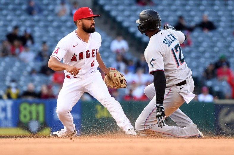 Apr 12, 2022; Anaheim, California, USA; Miami Marlins designated hitter Jorge Soler (12) is caught stealing second by Los Angeles Angels second baseman Jack Mayfield (9) during the fifth inning at Angel Stadium. Mandatory Credit: Richard Mackson-USA TODAY Sports