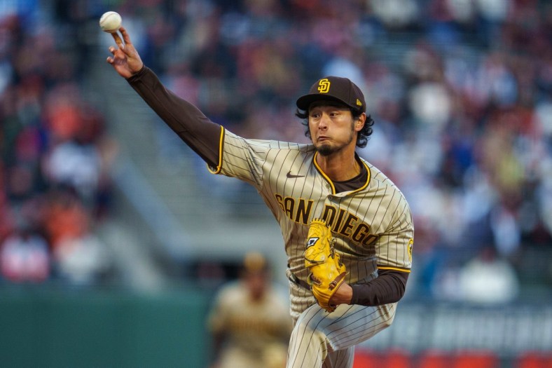 Apr 12, 2022; San Francisco, California, USA;  San Diego Padres starting pitcher Yu Darvish (11) delivers a pitch during the first inning against the San Francisco Giants at Oracle Park. Mandatory Credit: Neville E. Guard-USA TODAY Sports