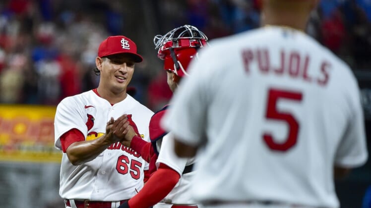 Apr 12, 2022; St. Louis, Missouri, USA;  St. Louis Cardinals relief pitcher Giovanny Gallegos (65) celebrates with catcher Andrew Knizner (7) after the Cardinals defeated the Kansas City Royals at Busch Stadium. Mandatory Credit: Jeff Curry-USA TODAY Sports