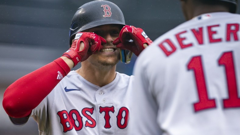 Apr 13, 2022; Detroit, Michigan, USA; Boston Red Sox center fielder Enrique Hernandez (5) celebrates with third baseman Rafael Devers (11) after hitting a solo home run during the third inning against the Detroit Tigers at Comerica Park. Mandatory Credit: Raj Mehta-USA TODAY Sports