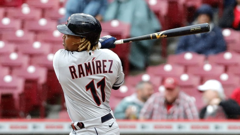 Apr 13, 2022; Cincinnati, Ohio, USA; Cleveland Guardians third baseman Jose Ramirez (11) hits a double against the Cincinnati Reds during the sixth inning at Great American Ball Park. Mandatory Credit: David Kohl-USA TODAY Sports