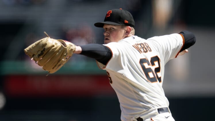 Apr 13, 2022; San Francisco, California, USA; San Francisco Giants pitcher Logan Webb (62) delivers a pitch against the San Diego Padres during the first inning at Oracle Park. Mandatory Credit: D. Ross Cameron-USA TODAY Sports