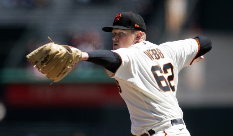 Apr 13, 2022; San Francisco, California, USA; San Francisco Giants pitcher Logan Webb (62) delivers a pitch against the San Diego Padres during the first inning at Oracle Park. Mandatory Credit: D. Ross Cameron-USA TODAY Sports