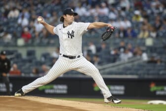 Apr 13, 2022; Bronx, New York, USA;  New York Yankees starting pitcher Gerrit Cole (45) pitches in the first inning against the Toronto Blue Jays at Yankee Stadium. Mandatory Credit: Wendell Cruz-USA TODAY Sports