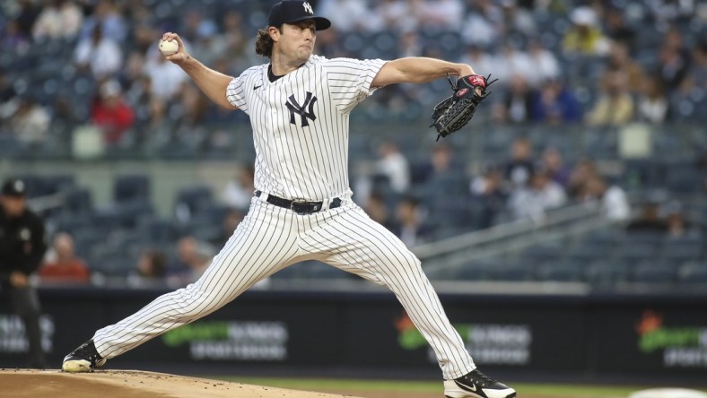 Apr 13, 2022; Bronx, New York, USA;  New York Yankees starting pitcher Gerrit Cole (45) pitches in the first inning against the Toronto Blue Jays at Yankee Stadium. Mandatory Credit: Wendell Cruz-USA TODAY Sports