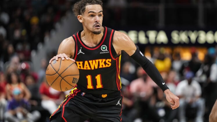 Apr 13, 2022; Atlanta, Georgia, USA; Atlanta Hawks guard Trae Young (11) controls the ball against the Charlotte Hornets during the second half at State Farm Arena. Mandatory Credit: Dale Zanine-USA TODAY Sports