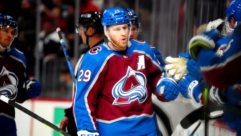 Apr 13, 2022; Denver, Colorado, USA; Colorado Avalanche center Nathan MacKinnon (29) celebrates his goal in the first period against the Los Angeles Kings at Ball Arena. Mandatory Credit: Ron Chenoy-USA TODAY Sports