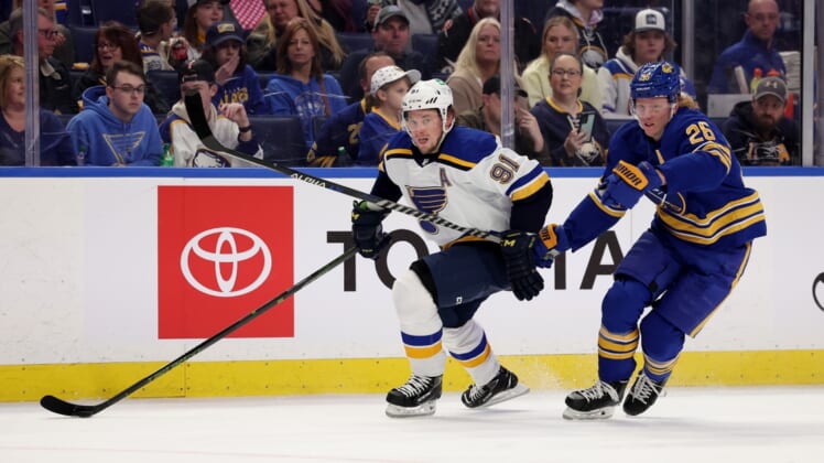 Apr 14, 2022; Buffalo, New York, USA;  St. Louis Blues right wing Vladimir Tarasenko (91) and Buffalo Sabres defenseman Rasmus Dahlin (26) looks for the puck during the first period at KeyBank Center. Mandatory Credit: Timothy T. Ludwig-USA TODAY Sports