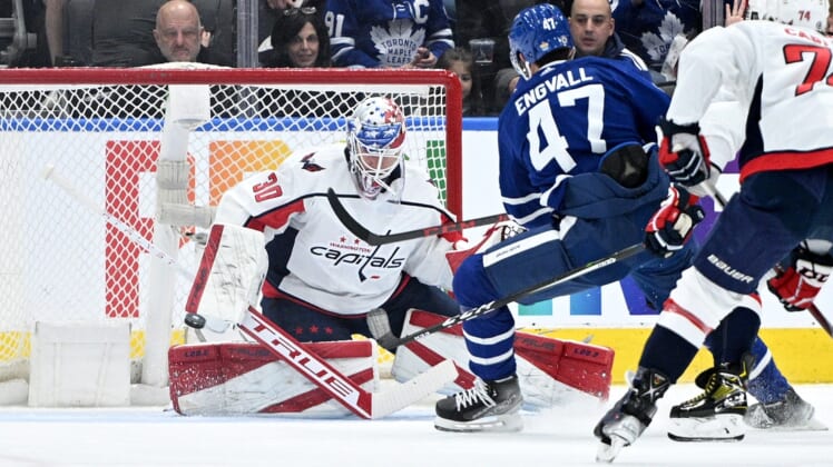 Apr 14, 2022; Toronto, Ontario, CAN;  Washington Capitals goalie Ilya Samsonov (30) makes a save on a shot from Toronto Maple Leafs forward Pierre Engvall (47) in the first  period at Scotiabank Arena. Mandatory Credit: Dan Hamilton-USA TODAY Sports