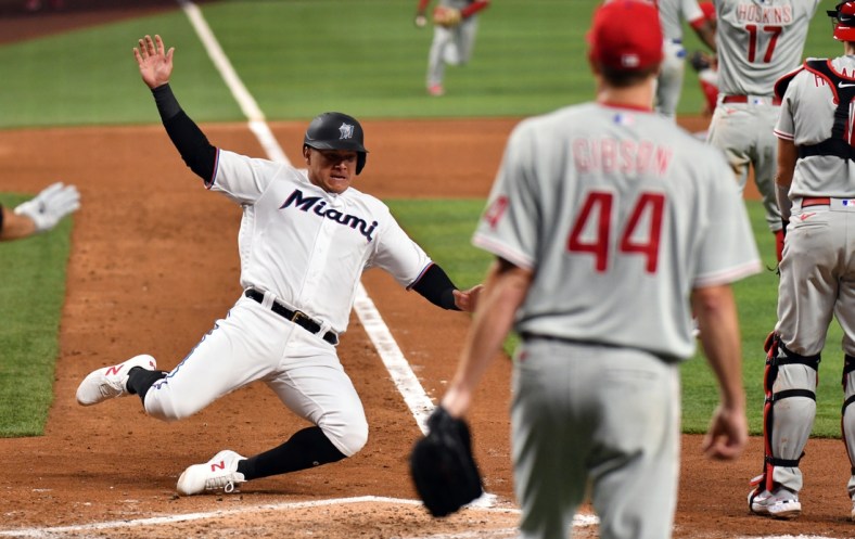 Apr 14, 2022; Miami, Florida, USA; Miami Marlins right fielder Avisail Garcia (24) scores a run in the fourth inning against the Philadelphia Phillies at loanDepot Park. Mandatory Credit: Jim Rassol-USA TODAY Sports