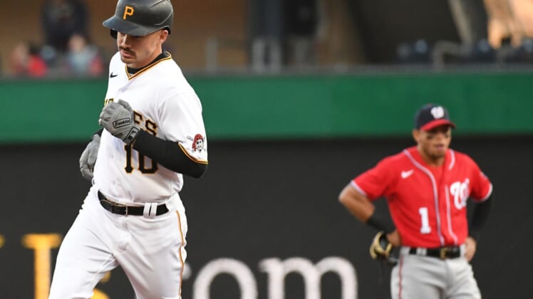 Apr 14, 2022; Pittsburgh, Pennsylvania, USA; Pittsburgh Pirates Bryan Reynolds (10) passes Washington Nationals second baseman Cesar Hernandez (1) after hitting a two-run hiomerun in the third inning against the Washington Nationals at PNC Park. Mandatory Credit: Philip G. Pavely-USA TODAY Sports