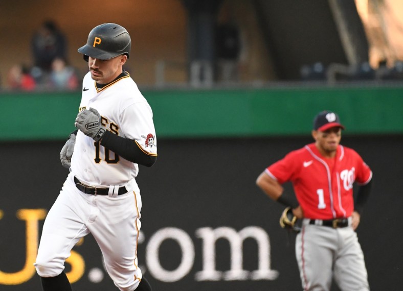 Apr 14, 2022; Pittsburgh, Pennsylvania, USA; Pittsburgh Pirates Bryan Reynolds (10) passes Washington Nationals second baseman Cesar Hernandez (1) after hitting a two-run hiomerun in the third inning against the Washington Nationals at PNC Park. Mandatory Credit: Philip G. Pavely-USA TODAY Sports