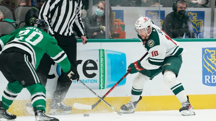 Apr 14, 2022; Dallas, Texas, USA;  Dallas Stars defenseman Ryan Suter (20) defends against Minnesota Wild center Tyson Jost (10) during the first period at American Airlines Center. Mandatory Credit: Chris Jones-USA TODAY Sports