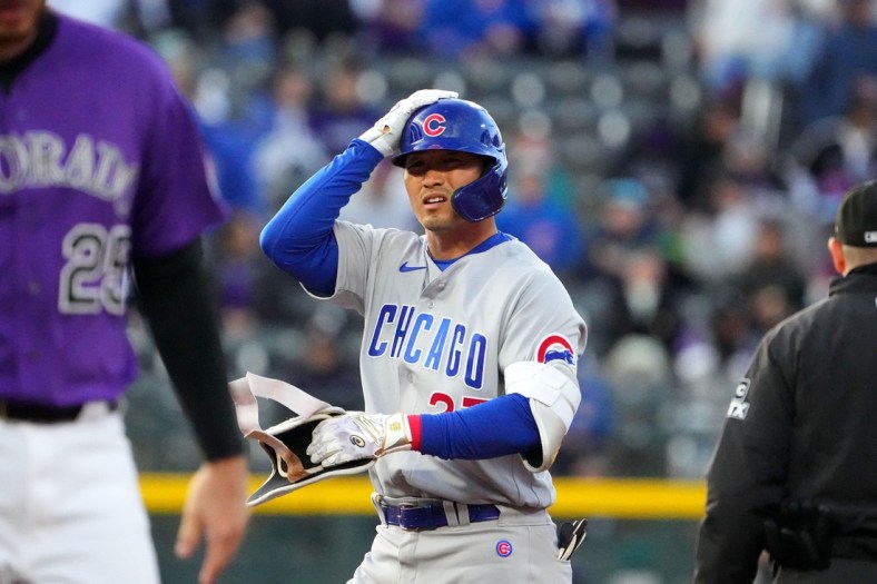 Apr 14, 2022; Denver, Colorado, USA; Chicago Cubs right fielder Seiya Suzuki (27) following his RBI double in the first inning against the Colorado Rockies at Coors Field. Mandatory Credit: Ron Chenoy-USA TODAY Sports