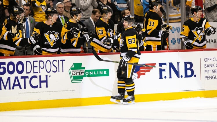 Apr 14, 2022; Pittsburgh, Pennsylvania, USA; Pittsburgh Penguins center Sidney Crosby (87) celebrates after scoring a goal during the third period at PPG Paints Arena. The Penguins won 6-3. Mandatory Credit: Mark Alberti-USA TODAY Sports