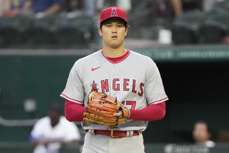 Apr 14, 2022; Arlington, Texas, USA; Los Angeles Angels starting pitcher Shohei Ohtani (17) prepares to deliver a pitch to the Texas Rangers during the first inning of a baseball game at Globe Life Field. Mandatory Credit: Jim Cowsert-USA TODAY Sports1