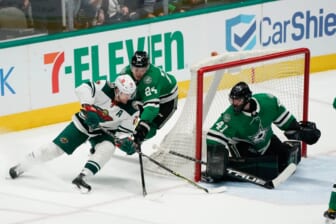 Apr 14, 2022; Dallas, Texas, USA;  Dallas Stars center Roope Hintz (24)defends Minnesota Wild left wing Marcus Foligno (17) during the third period at American Airlines Center. Mandatory Credit: Chris Jones-USA TODAY Sports