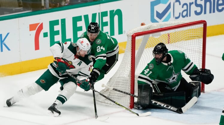 Apr 14, 2022; Dallas, Texas, USA;  Dallas Stars center Roope Hintz (24)defends Minnesota Wild left wing Marcus Foligno (17) during the third period at American Airlines Center. Mandatory Credit: Chris Jones-USA TODAY Sports