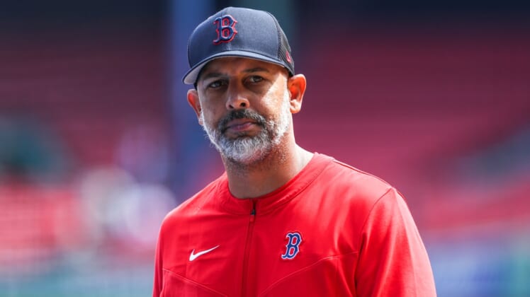 Apr 15, 2022; Boston, Massachusetts, USA; Boston Red Sox manager Alex Cora (13) reacts before playing the Minnesota Twins at Fenway Park. Mandatory Credit: Paul Rutherford-USA TODAY Sports