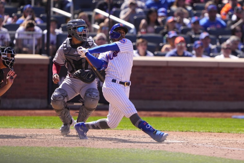 Apr 15, 2022; New York City, New York, USA; New York Mets shortstop Francisco Lindor (12) hits a two run home run against the Arizona Diamondbacks during the fifth inning at Citi Field. Mandatory Credit: Gregory Fisher-USA TODAY Sports