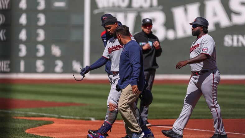 Apr 15, 2022; Boston, Massachusetts, USA; Minnesota Twins center fielder Byron Buxton (25) reacts during the first inning after getting injured against the Boston Red Sox at Fenway Park. Every player is wearing number 42 in honor of Jackie Robinson. Mandatory Credit: Paul Rutherford-USA TODAY Sports