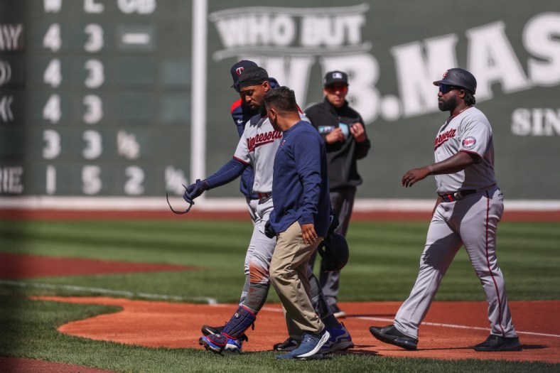 Apr 15, 2022; Boston, Massachusetts, USA; Minnesota Twins center fielder Byron Buxton (25) reacts during the first inning after getting injured against the Boston Red Sox at Fenway Park. Every player is wearing number 42 in honor of Jackie Robinson. Mandatory Credit: Paul Rutherford-USA TODAY Sports
