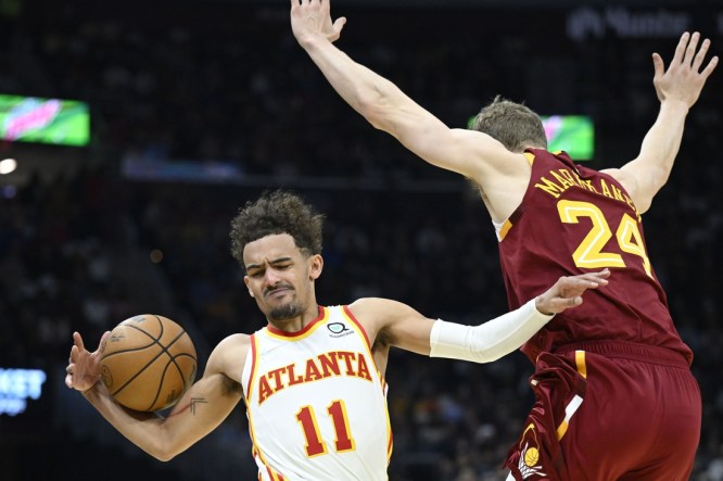 Apr 15, 2022; Cleveland, Ohio, USA; Cleveland Cavaliers forward Lauri Markkanen (24) defends Atlanta Hawks guard Trae Young (11) in the second quarter at Rocket Mortgage FieldHouse. Mandatory Credit: David Richard-USA TODAY Sports