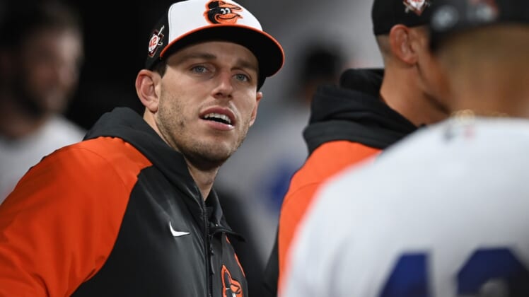 Apr 15, 2022; Baltimore, Maryland, USA;  Baltimore Orioles starting pitcher John Means stands in the dugout during the game against the New York Yankees at Oriole Park at Camden Yards.  Means was put on the IL today. Mandatory Credit: Tommy Gilligan-USA TODAY Sports