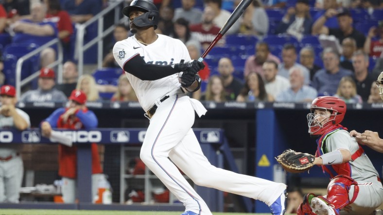 Apr 15, 2022; Miami, Florida, USA; Miami Marlins left fielder Jorge Soler follows through on his double during the first inning against the Philadelphia Phillies at loanDepot Park. Mandatory Credit: Rhona Wise-USA TODAY Sports