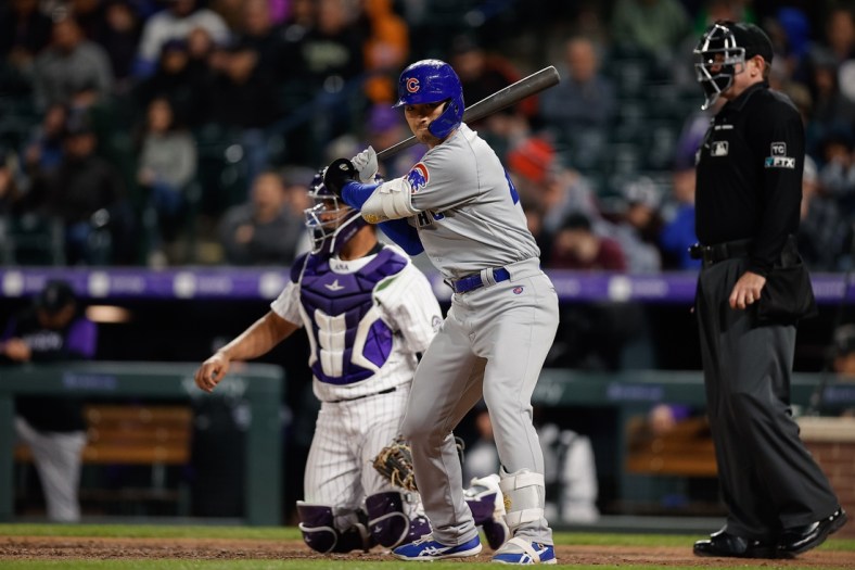 Apr 15, 2022; Denver, Colorado, USA; Chicago Cubs pinch hitter Seiya Suzuki takes a swing before stepping into the batters box in the fifth inning against the Colorado Rockies at Coors Field. Mandatory Credit: Isaiah J. Downing-USA TODAY Sports
