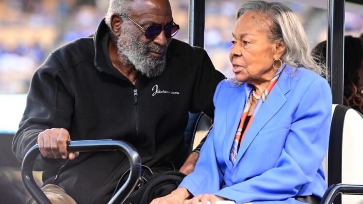 Apr 15, 2022; Los Angeles, California, USA; David Robinson and Rachel Robinson on had for pre-game ceremonies to celebrate the 75th anniversary of Jackie Robinson breaking the color barrier in Major League Baseball before the game against the Cincinnati Reds at Dodger Stadium. Mandatory Credit: Jayne Kamin-Oncea-USA TODAY Sports