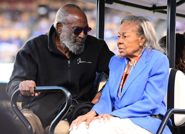 Apr 15, 2022; Los Angeles, California, USA; David Robinson and Rachel Robinson on had for pre-game ceremonies to celebrate the 75th anniversary of Jackie Robinson breaking the color barrier in Major League Baseball before the game against the Cincinnati Reds at Dodger Stadium. Mandatory Credit: Jayne Kamin-Oncea-USA TODAY Sports