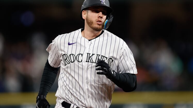 Apr 15, 2022; Denver, Colorado, USA; Colorado Rockies designated hitter C.J. Cron rounds the bases on a solo home run in the fifth inning against the Chicago Cubs at Coors Field. Mandatory Credit: Isaiah J. Downing-USA TODAY Sports