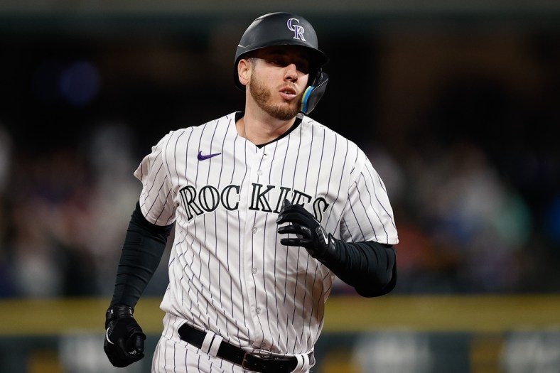 Apr 15, 2022; Denver, Colorado, USA; Colorado Rockies designated hitter C.J. Cron rounds the bases on a solo home run in the fifth inning against the Chicago Cubs at Coors Field. Mandatory Credit: Isaiah J. Downing-USA TODAY Sports