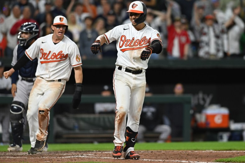 Apr 15, 2022; Baltimore, Maryland, USA;  Baltimore Orioles shortstop Ramon Urias reacts after being walked with the bases loaded scoring left fielder Austin Hays in the eleventh inning to beat against the New York Yankees at Oriole Park at Camden Yards. Mandatory Credit: Tommy Gilligan-USA TODAY Sports