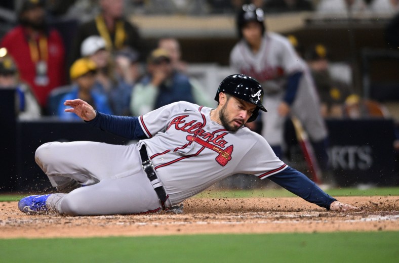 Apr 15, 2022; San Diego, California, USA; Atlanta Braves catcher Travis d'Arnaud scores a run on a two-RBI double hit by center fielder Adam Duvall (not pictured) during the eighth inning against the San Diego Padres at Petco Park. Mandatory Credit: Orlando Ramirez-USA TODAY Sports