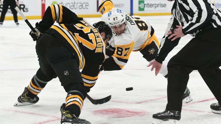 Apr 16, 2022; Boston, Massachusetts, USA; Pittsburgh Penguins center Sidney Crosby (87) and Boston Bruins center Patrice Bergeron (37) at a face-off during the second period at TD Garden. Mandatory Credit: Brian Fluharty-USA TODAY Sports