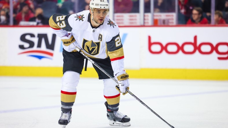 Apr 14, 2022; Calgary, Alberta, CAN; Vegas Golden Knights defenseman Alec Martinez (23) during the face off against the Calgary Flames during the second period at Scotiabank Saddledome. Mandatory Credit: Sergei Belski-USA TODAY Sports