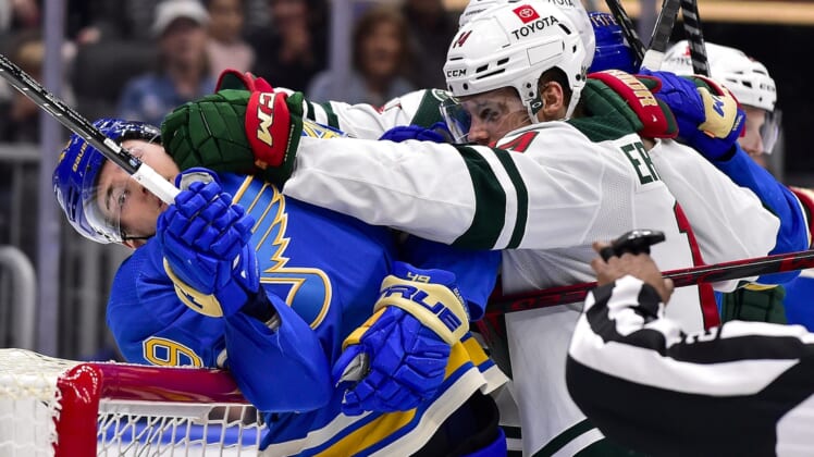 Apr 16, 2022; St. Louis, Missouri, USA;  St. Louis Blues center Ivan Barbashev (49) is pushed in to the net by Minnesota Wild center Joel Eriksson Ek (14) during the second period at Enterprise Center. Mandatory Credit: Jeff Curry-USA TODAY Sports