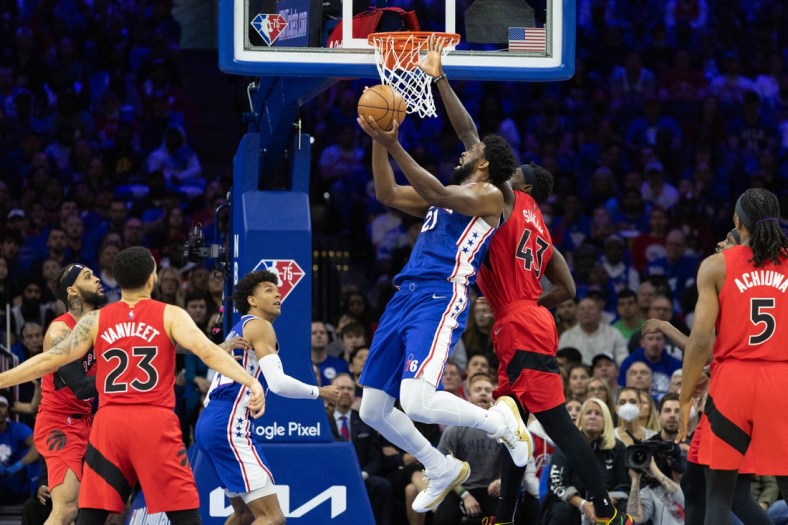 Apr 16, 2022; Philadelphia, Pennsylvania, USA; Philadelphia 76ers center Joel Embiid (21) drives for a shot against Toronto Raptors forward Pascal Siakam (43) during the first quarter of game one of the first round for the 2022 NBA playoffs at Wells Fargo Center. Mandatory Credit: Bill Streicher-USA TODAY Sports
