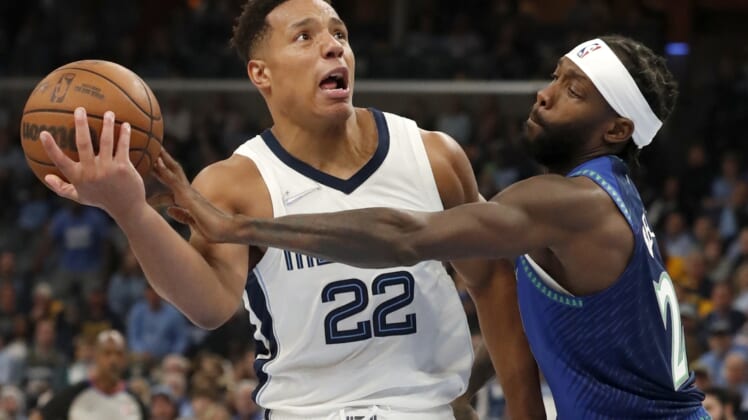 Apr 16, 2022; Memphis, Tennessee, USA; Memphis Grizzlies guard Desmond Bane (22) keeps ahold of the ball as he is guarded by Minnesota Timberwolves guard Patrick Beverley (22) during the second half of game one of the first round for the 2022 NBA playoffs at FedExForum. Mandatory Credit: Christine Tannous-USA TODAY Sports