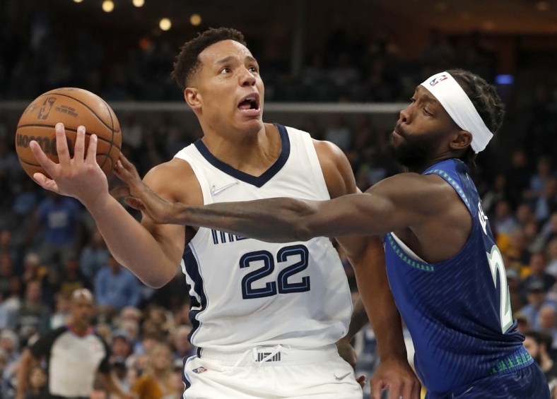 Apr 16, 2022; Memphis, Tennessee, USA; Memphis Grizzlies guard Desmond Bane (22) keeps ahold of the ball as he is guarded by Minnesota Timberwolves guard Patrick Beverley (22) during the second half of game one of the first round for the 2022 NBA playoffs at FedExForum. Mandatory Credit: Christine Tannous-USA TODAY Sports