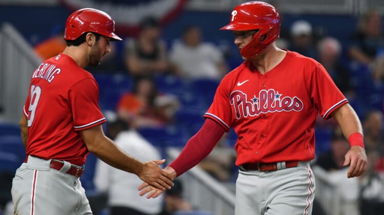 Apr 16, 2022; Miami, Florida, USA; Philadelphia Phillies first baseman Rhys Hoskins (right) and teammate center fielder Matt Vierling celebrate each scoring a run in the second inning against the Miami Marlins at loanDepot Park. Mandatory Credit: Jim Rassol-USA TODAY Sports
