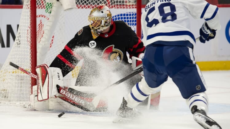 Apr 16, 2022; Ottawa, Ontario, CAN; Ottawa Senators goalie Anton Forsberg (31) makes a save on a shot from Toronto Maple Leafs left wing Michael Bunting (58) in the first period at the Canadian Tire Centre. Mandatory Credit: Marc DesRosiers-USA TODAY Sports