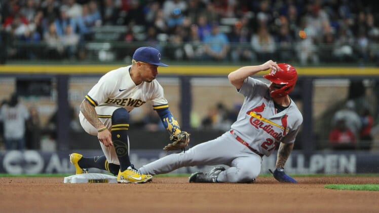 Apr 16, 2022; Milwaukee, Wisconsin, USA;  St. Louis Cardinals left fielder Tyler ONeill (27) steals second base ahead of the tag of Milwaukee Brewers second baseman Kolten Wong (16) in the fourth inning at American Family Field. Mandatory Credit: Michael McLoone-USA TODAY Sports