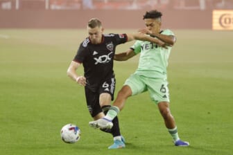 Apr 16, 2022; Washington, District of Columbia, USA; D.C. United midfielder Russell Canouse (6) and Austin FC midfielder Daniel Pereira (6) battle for the ball in the first half at Audi Field. Mandatory Credit: Geoff Burke-USA TODAY Sports